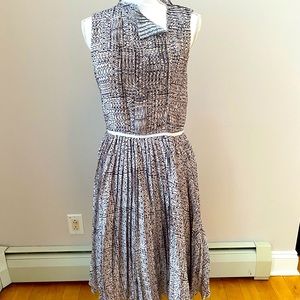 Pleated dress with unique collar